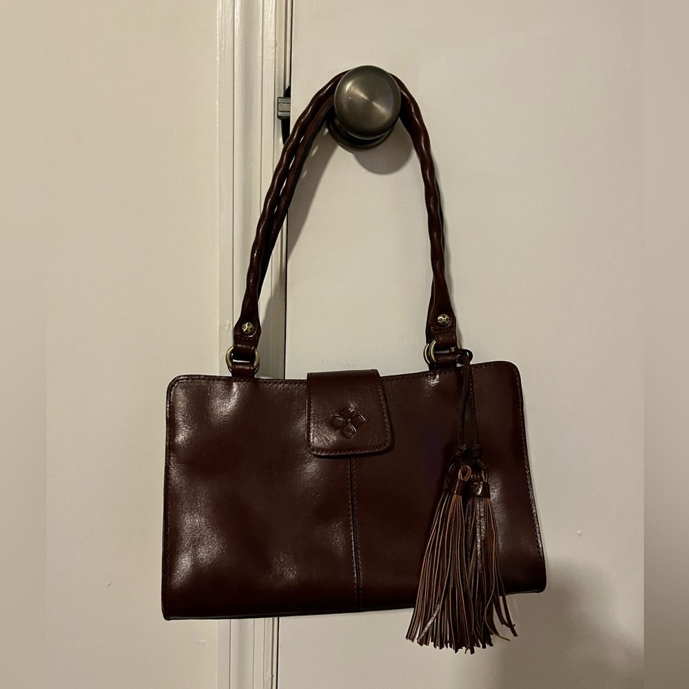 NWOT Patricia Nash Rienzo satchel, rich cognac brown, 100% leather.